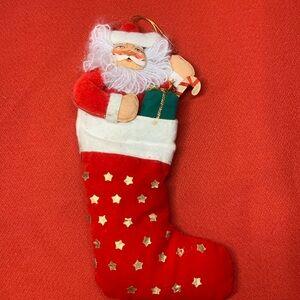 Christmas ornament Santa Claus inside a stocking 9” possibly anna lee